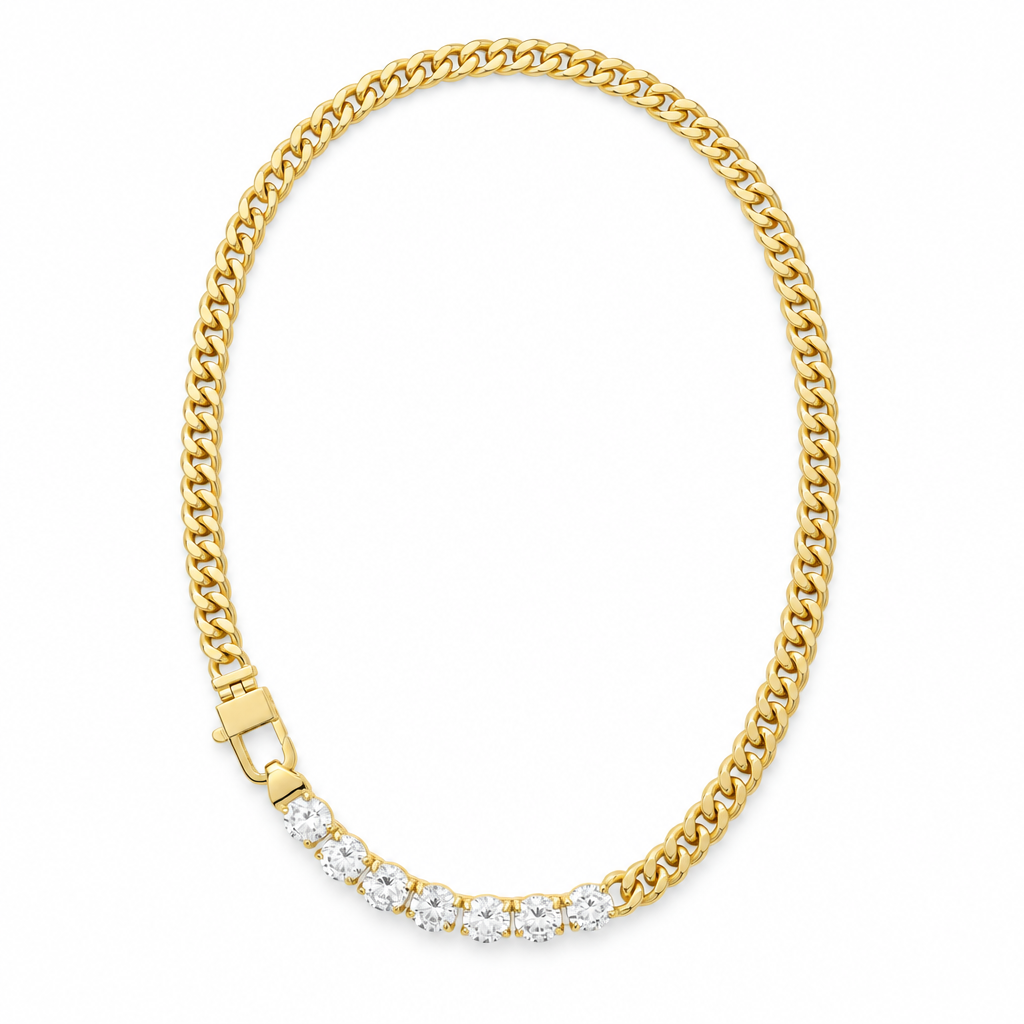 Gold Cuban link necklace with seven simulated diamonds on a white background