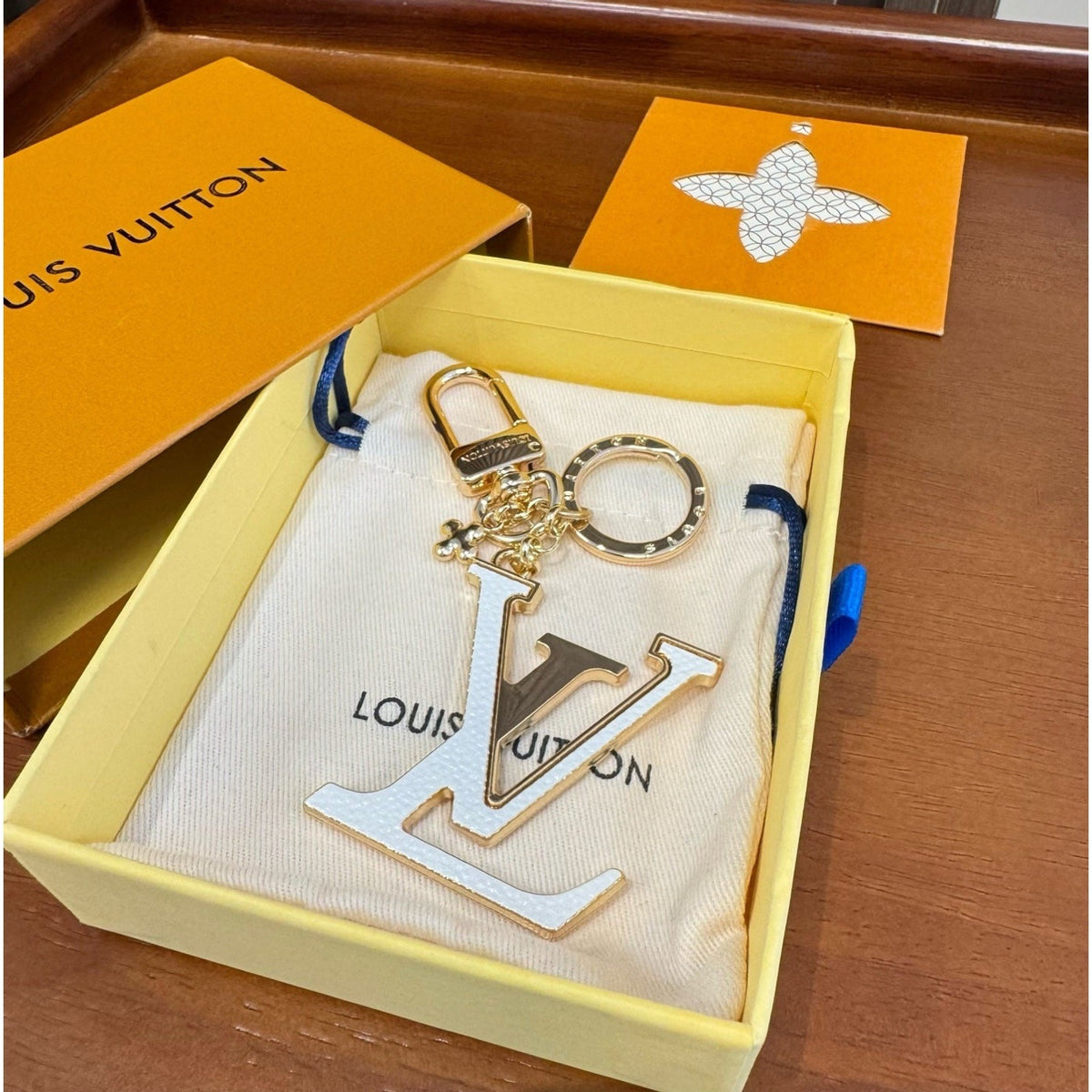 Louis Vuitton Brass Flower Bag Charm Keychain detail 3