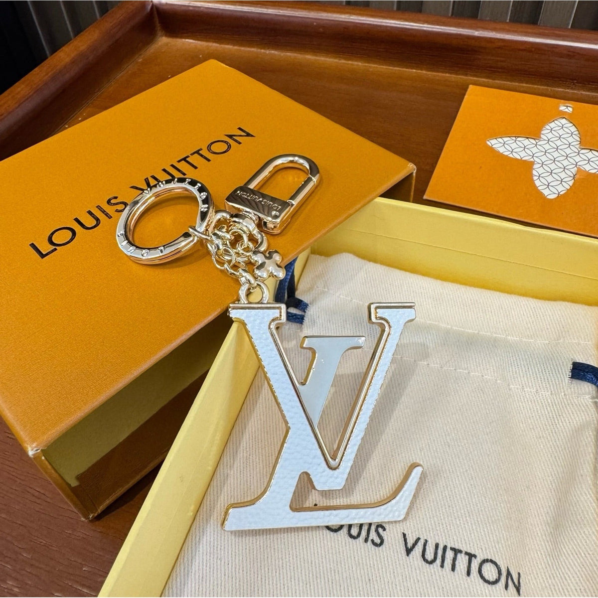 Louis Vuitton Brass Flower Bag Charm Keychain detail 4